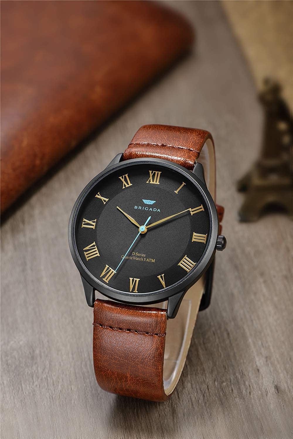 The watch with brown faux-leather band