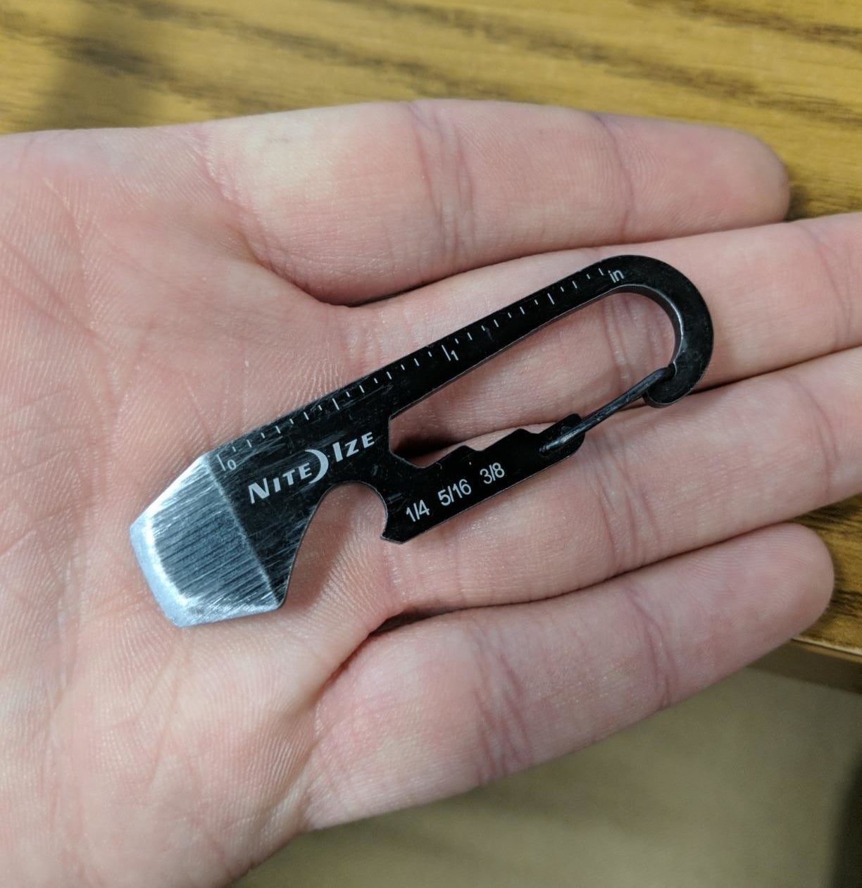 reviewer holding the tiny tool in their palm