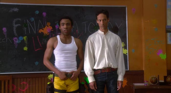 Troy and Abed standing in the anthropology room, which is splattered with paint, in &quot;Community&quot;