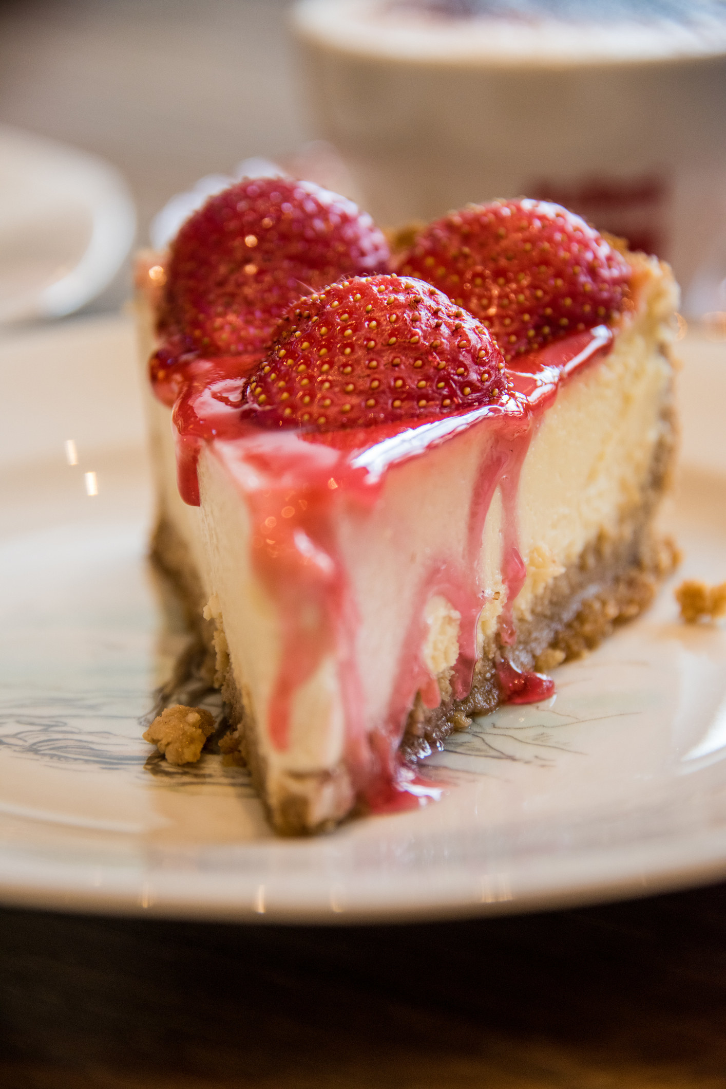 A slice of strawberry cheesecake.
