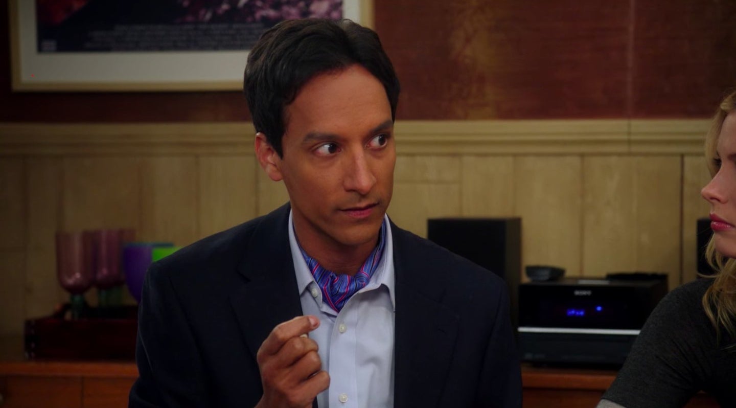 Abed holding a dice while sitting in his apartment in &quot;Community&quot;