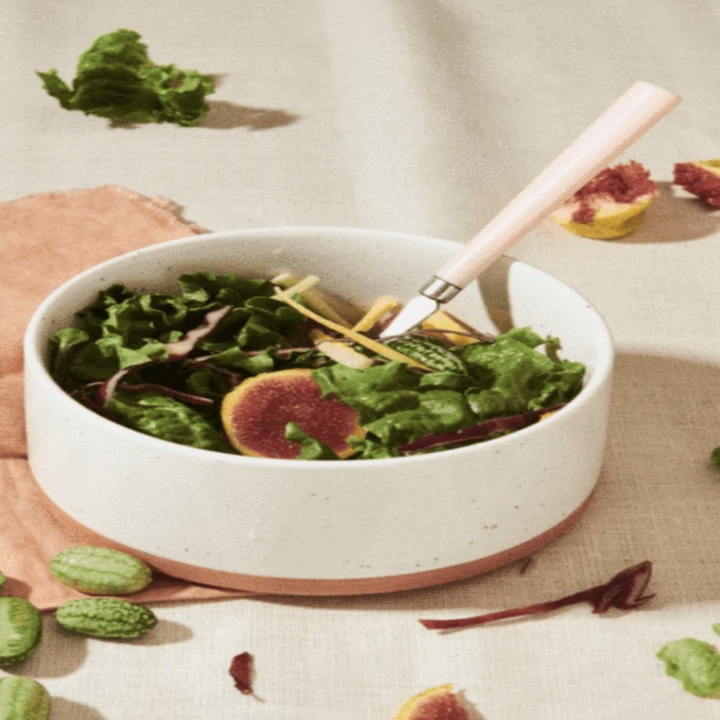 A bowl with salad in it