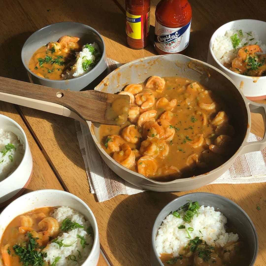 Étouffée in an Always Pan and bowls surrounding is