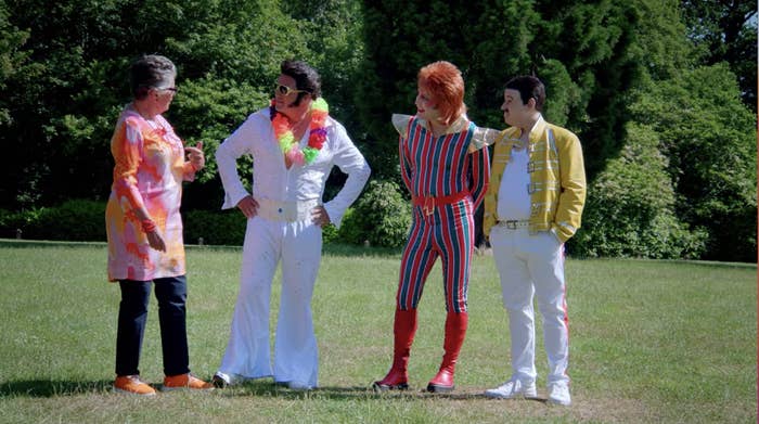 Paul dressed as Elvis, Noel as David Bowie, and Matt as Freddie Mercury, with Prue as herself