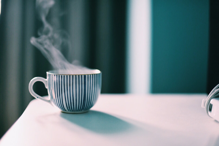 a steaming cup of something warm