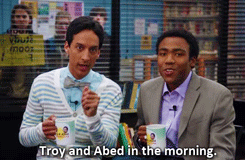 Troy and Abed holding coffee mugs and singing their talk show jingle in &quot;Community&quot;