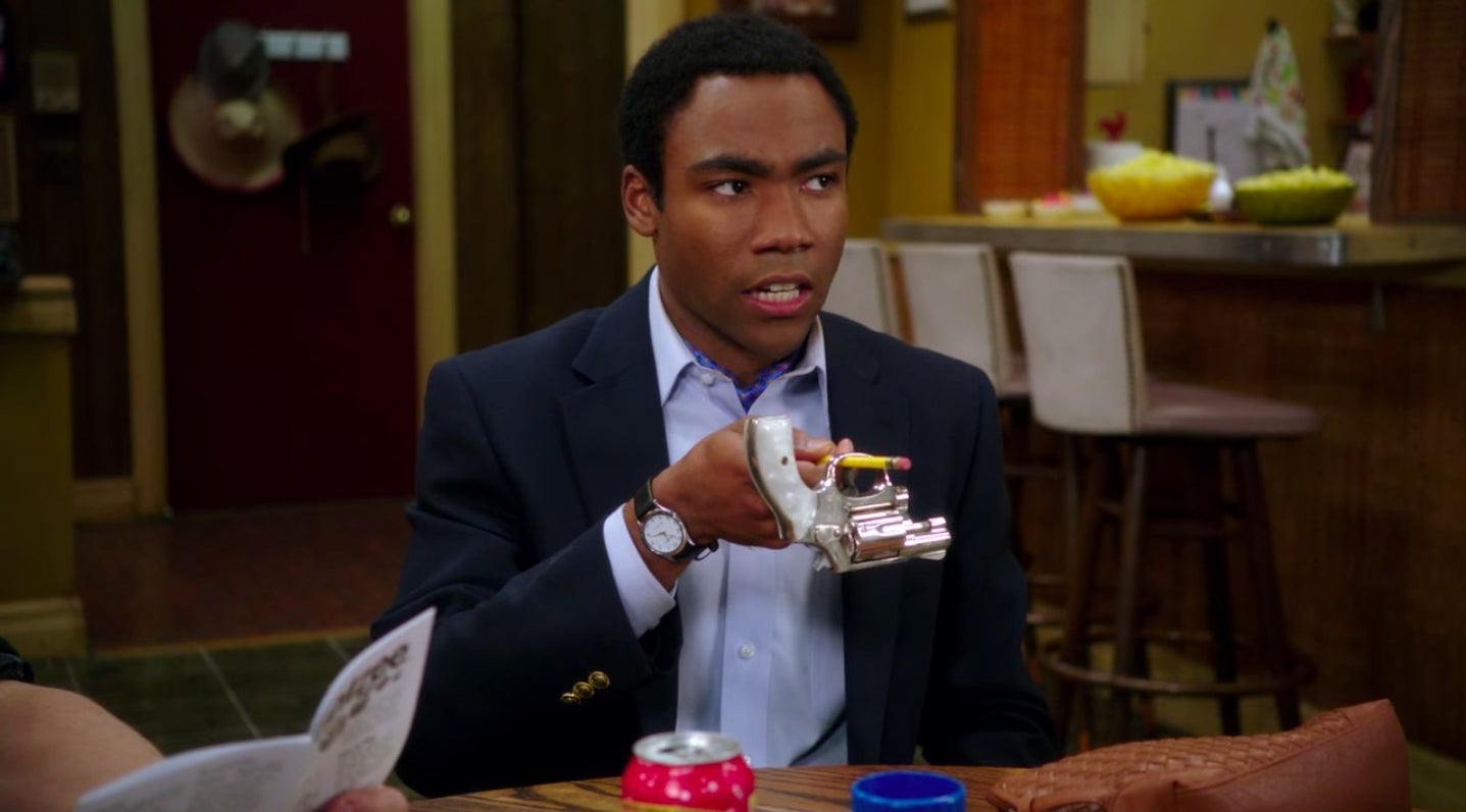 Troy holding a gun with a pencil in &quot;Community&quot;