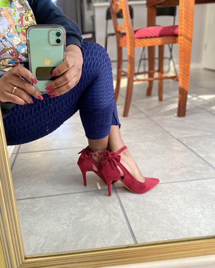 a reviewer wearing the heels in red