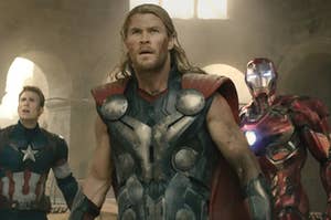 Captain America, Thor, and Iron Man stand together in a line