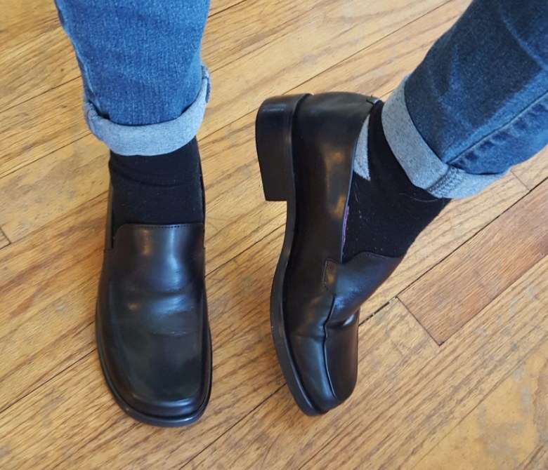 a reviewer wearing the loafers in black