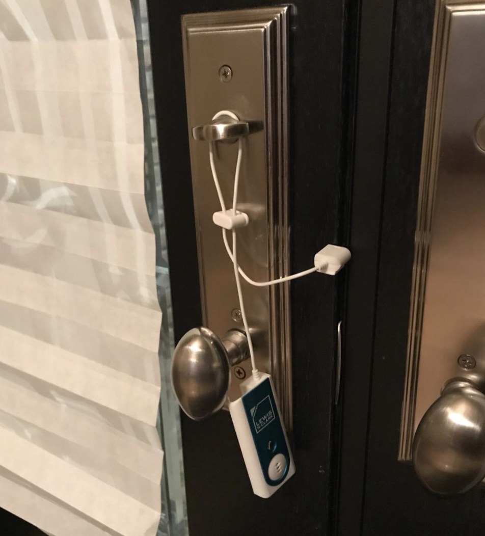 reviewer photo showing the alarm attached to their door
