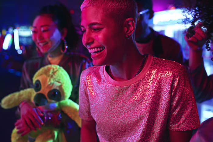 Two women smile inside Dave & Buster's.