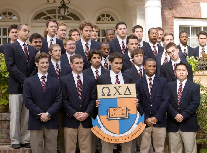 group of frat guys in suits posing together