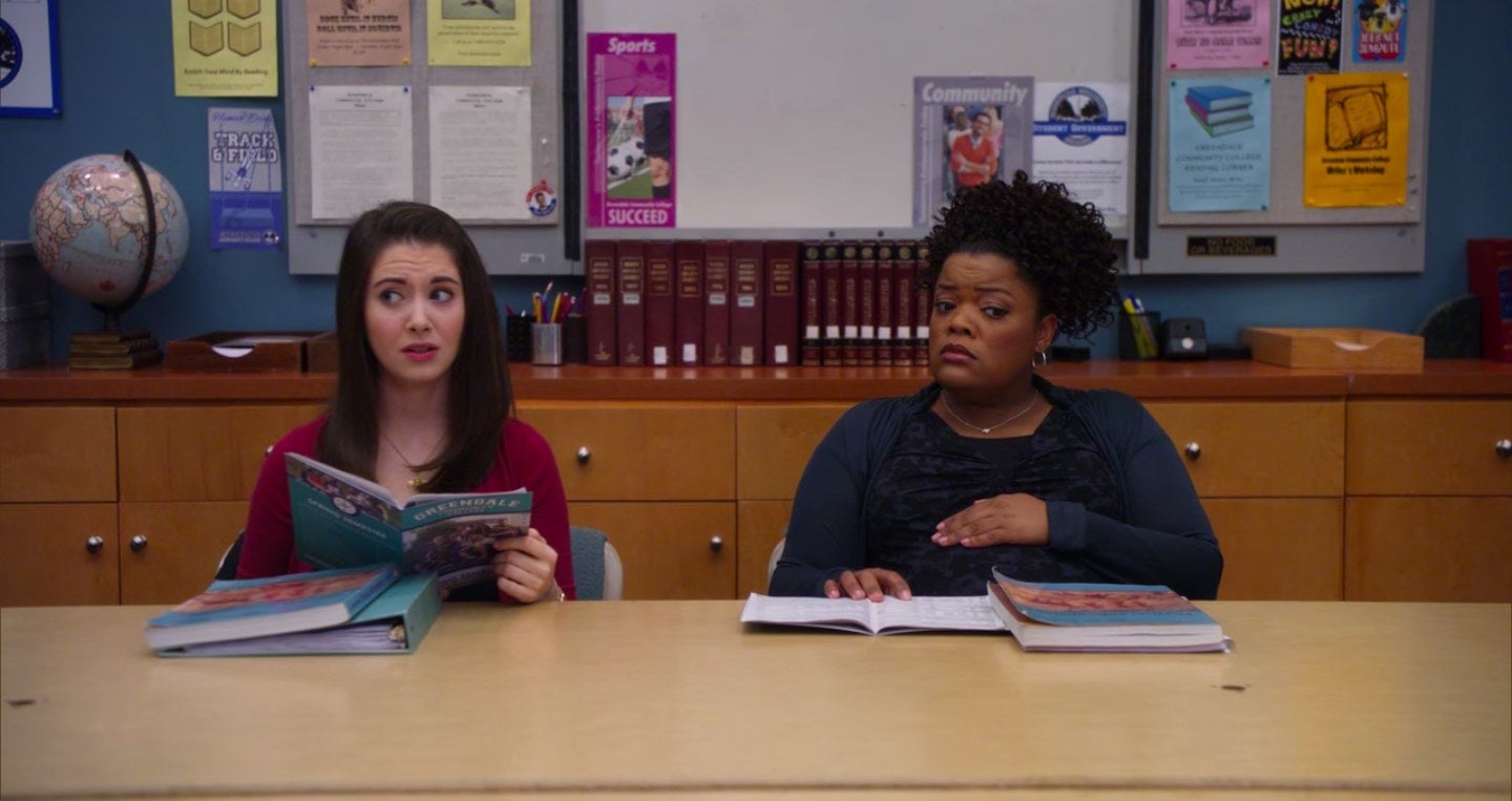 Annie and Shirley sitting next to each other in the study room in "Community"