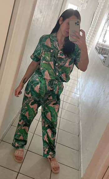 a reviewer wearing the pink and green leaves short-sleeve set.