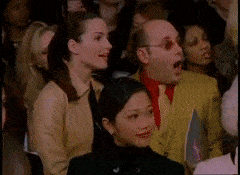 a gif from Sex and the City where Carrie is walking on a runway and falls