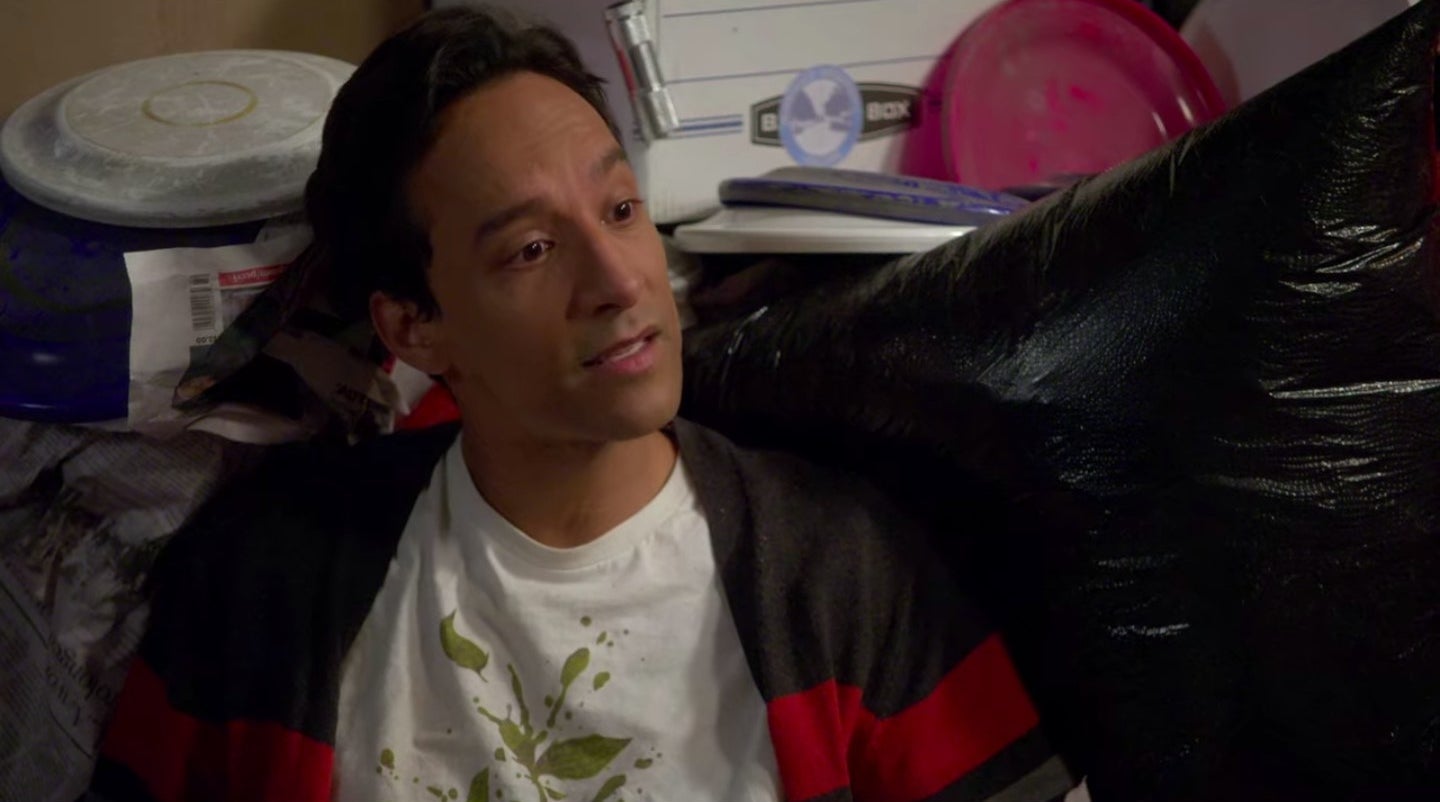 Abed talking while sitting in a supply closet filled with frisbees in &quot;Community&quot;