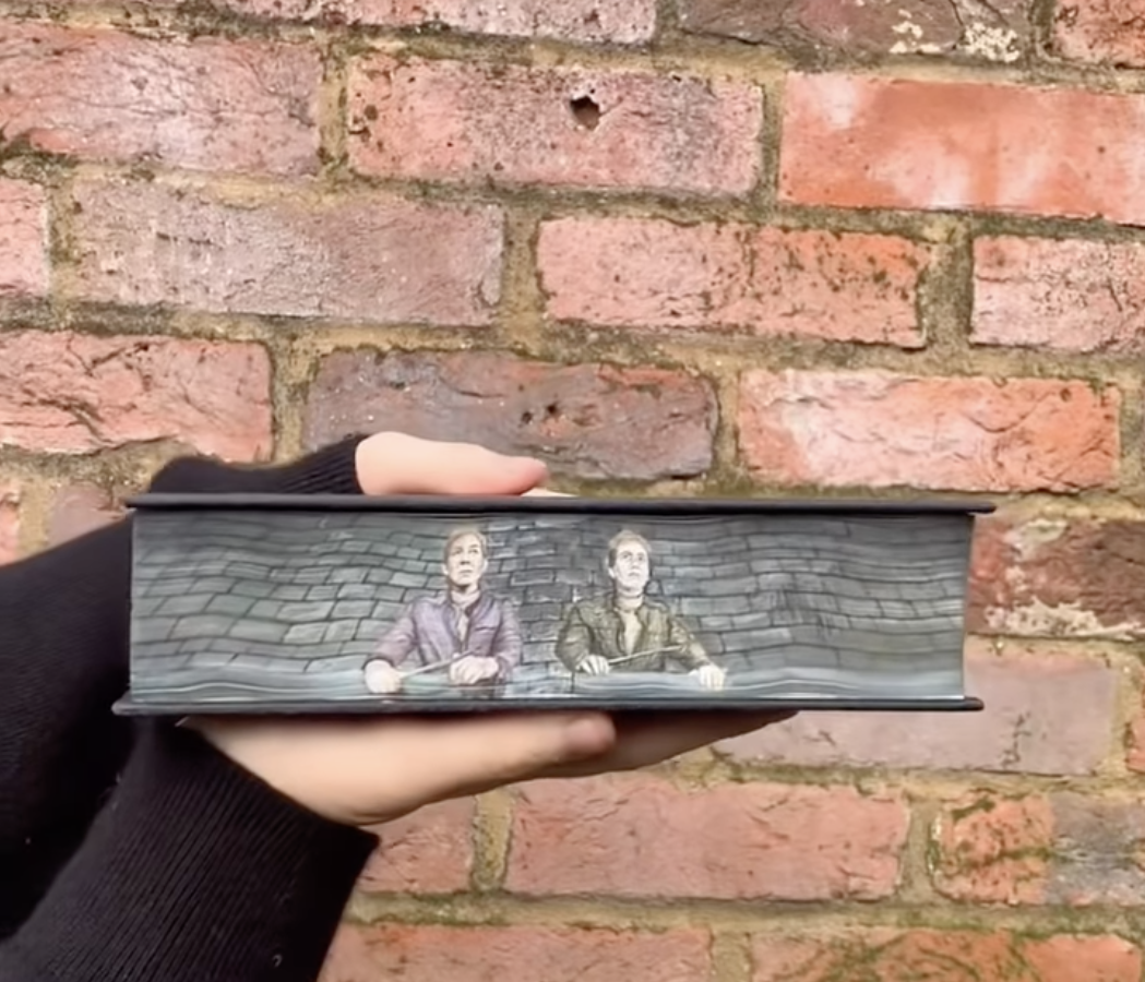 The Weasley twins painted on one book