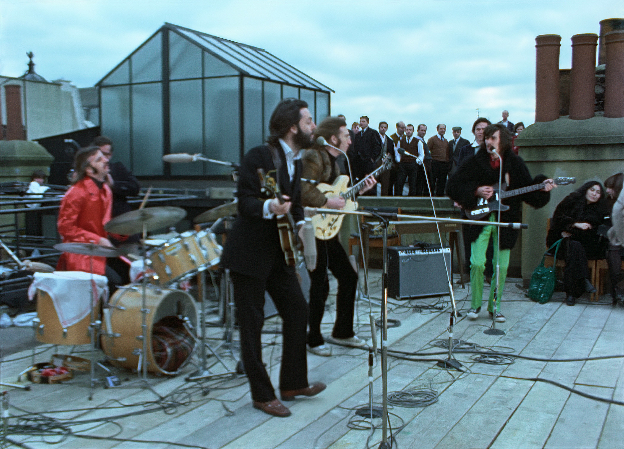 The Beatles perform on a roof
