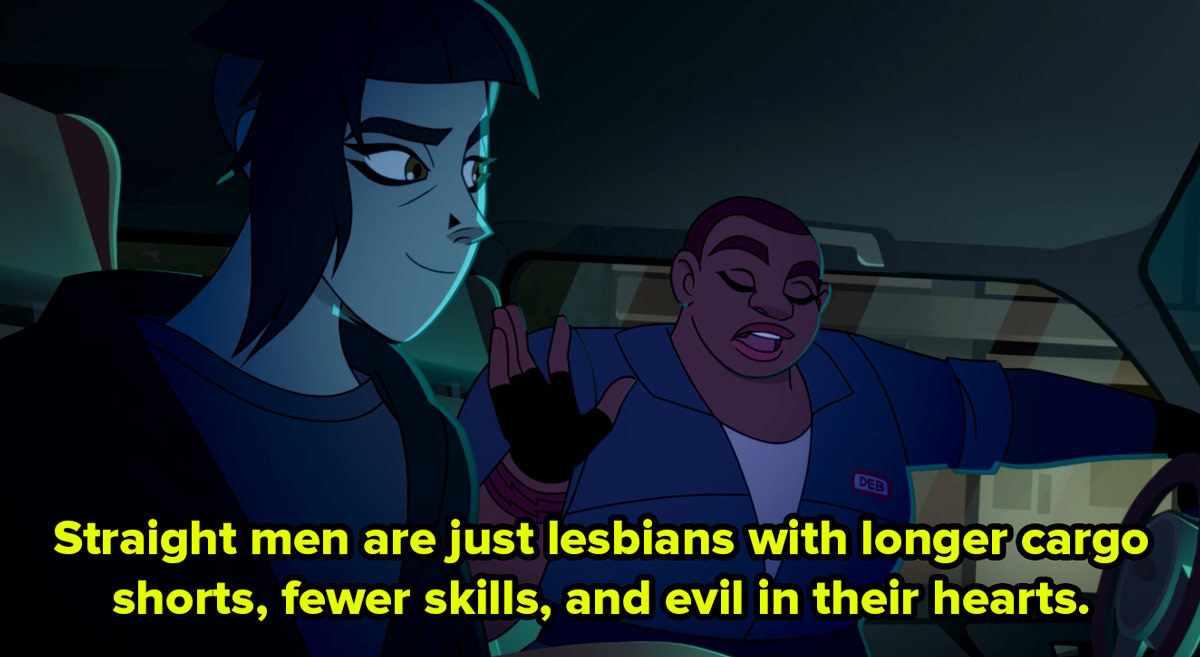 Two cartoon women in a car chat and one says straight men are just lesbians with longer cargo shorts, fewer skills, and evil in their hearts