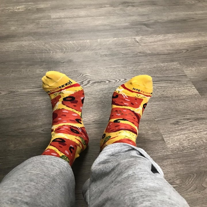 the reviewer wearing socks that look like pepperoni pizza
