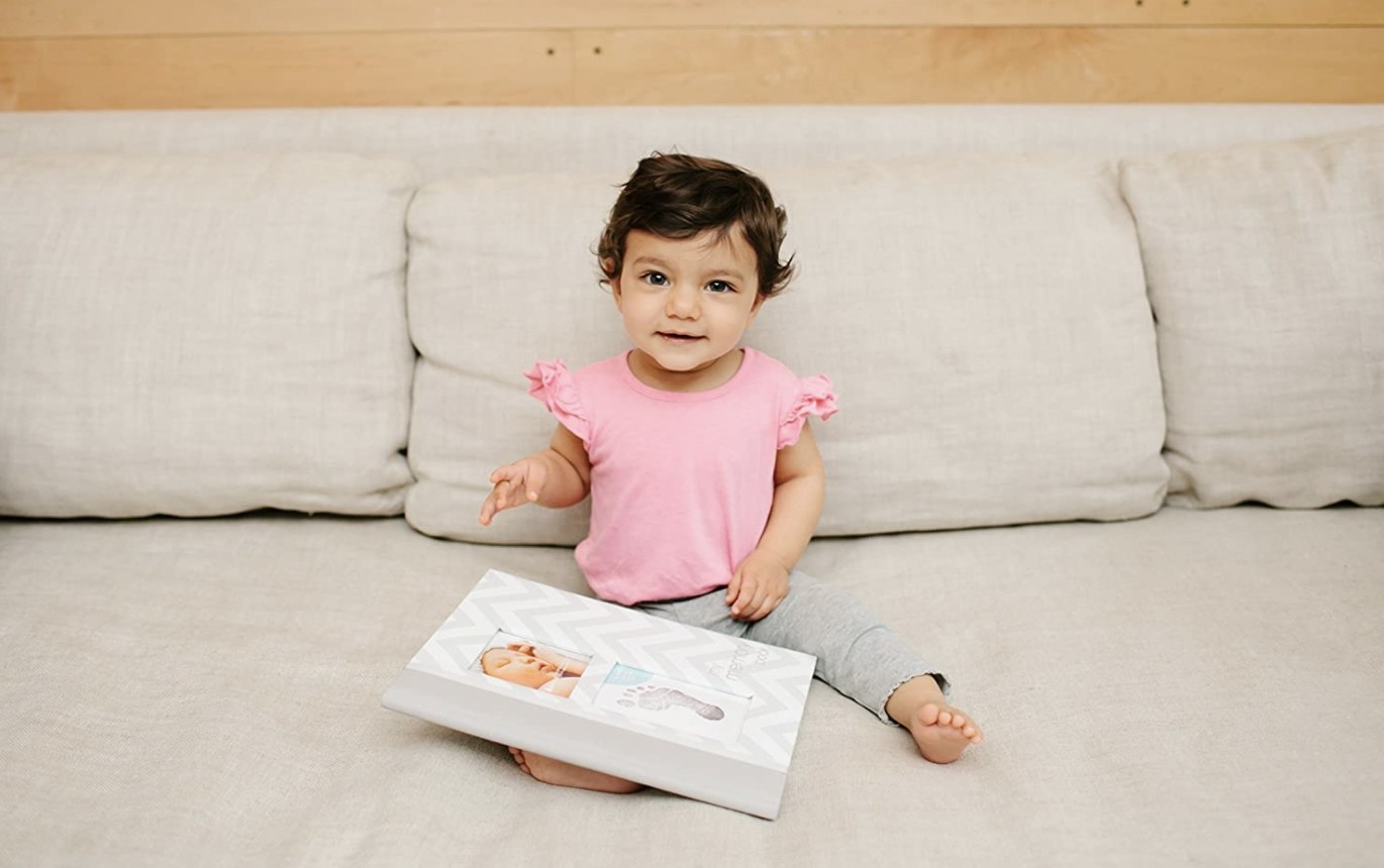 Baby with baby memory book