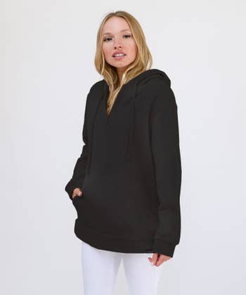 model wears same hoodie in a black color