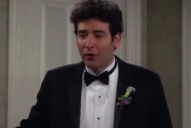 Ted wears a tuxedo and talks with passion