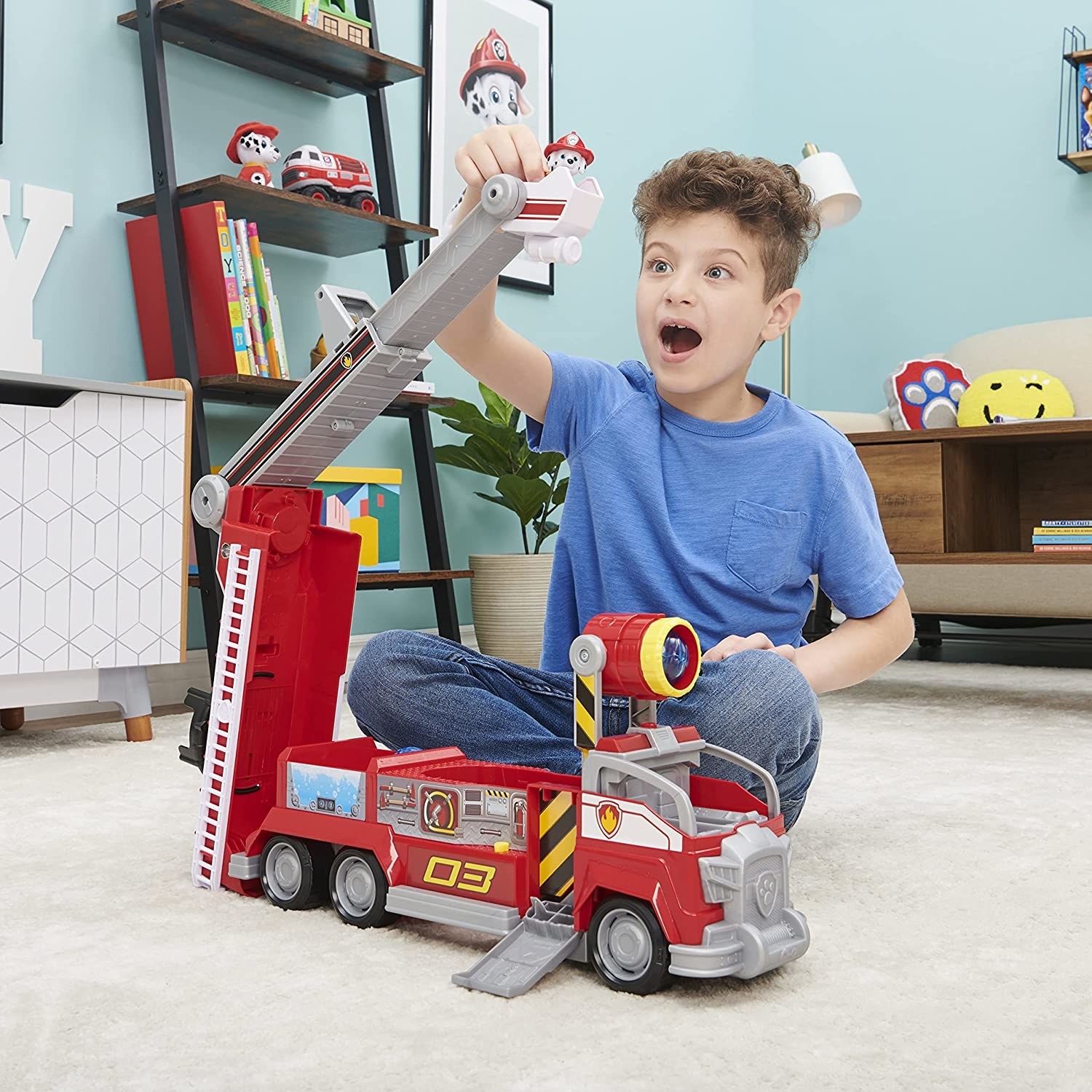 Child playing with Paw Patrol Movie fire truck