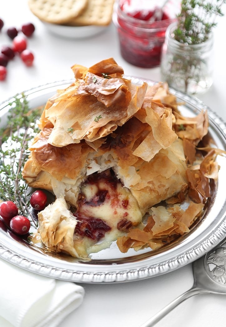 Baked Brie cheese with cranberry filling.