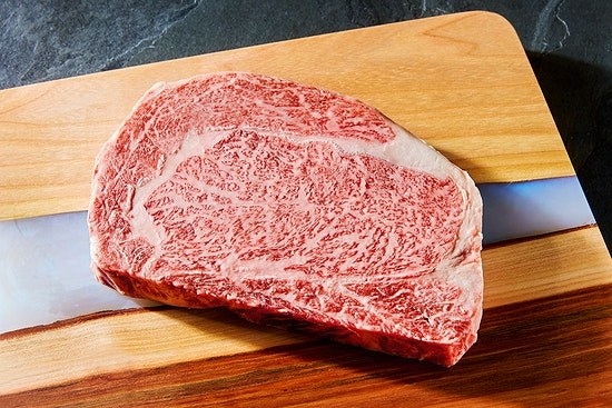 The 16-ounce steak on a cutting board
