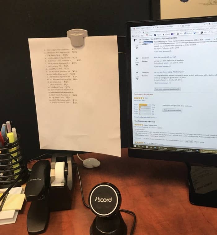 reviewer photo showing the monitor document clip with a piece of paper attached