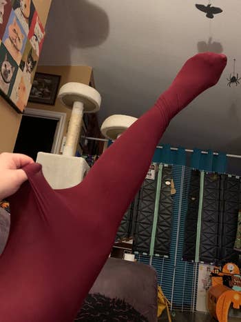 a reviewer showing their burgundy tights