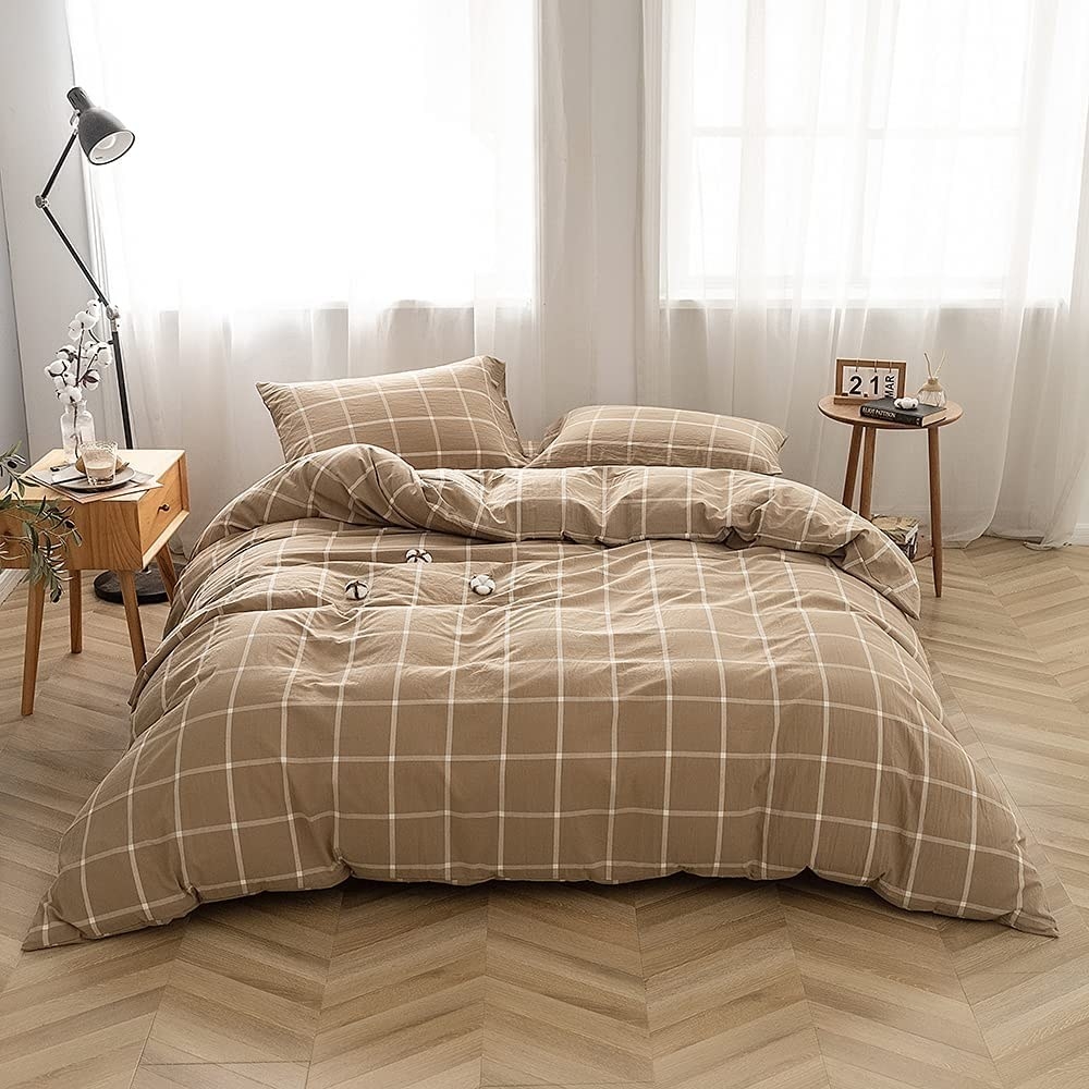Beige checkered duvet set on a bed