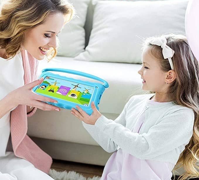 Product image of model handing blue tablet to child