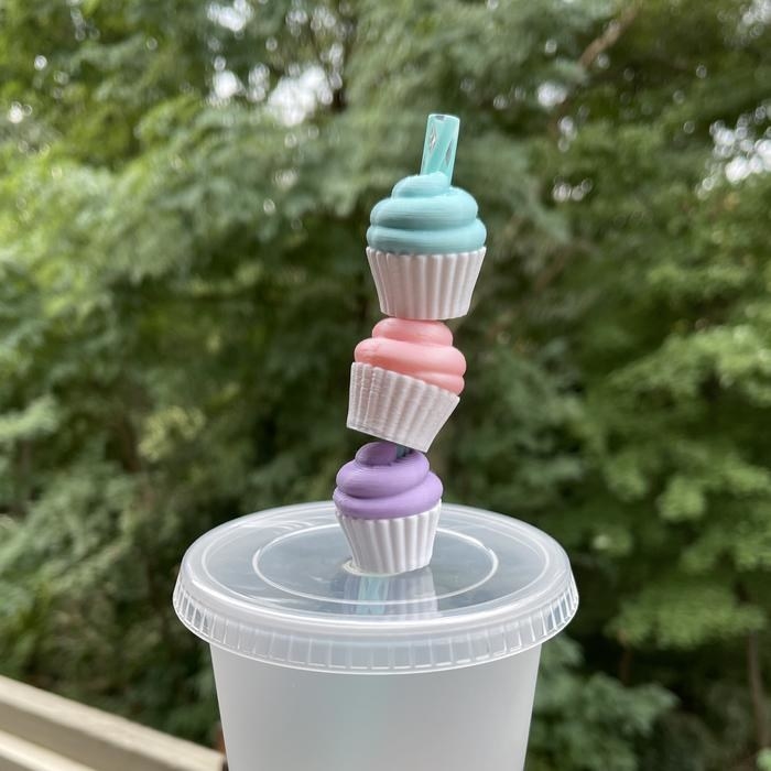 small cupcake with straw through it