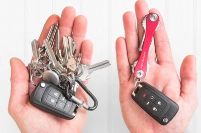 Hand holding a keyring cluttered with keys and then another hand holding a keyring with all keys organized into slim red tool
