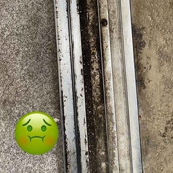 a reviewer photo of a dirty door track