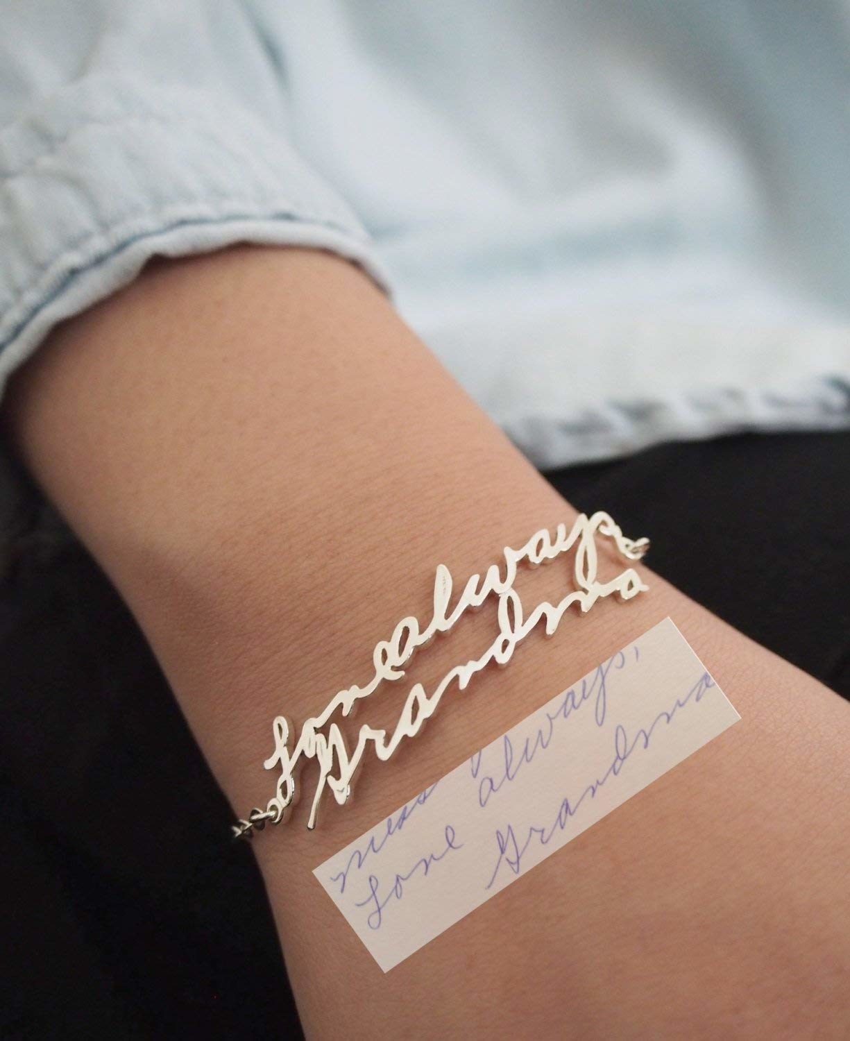 A model wearing one of the bracelets next to the writing sample they used to create it