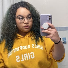 BuzzFeed Editor Kayla showing her hair after using the product