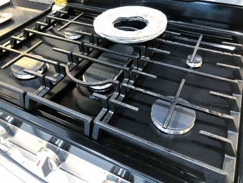 the burner covers on a gas stove
