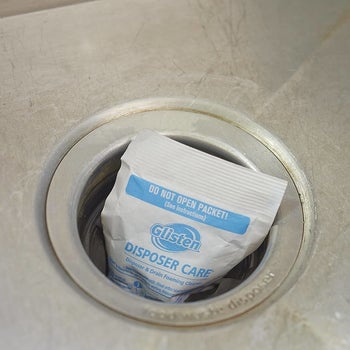 Garbage disposal cleaner packet in disposal