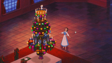belle singing at a makeshift christmas tree