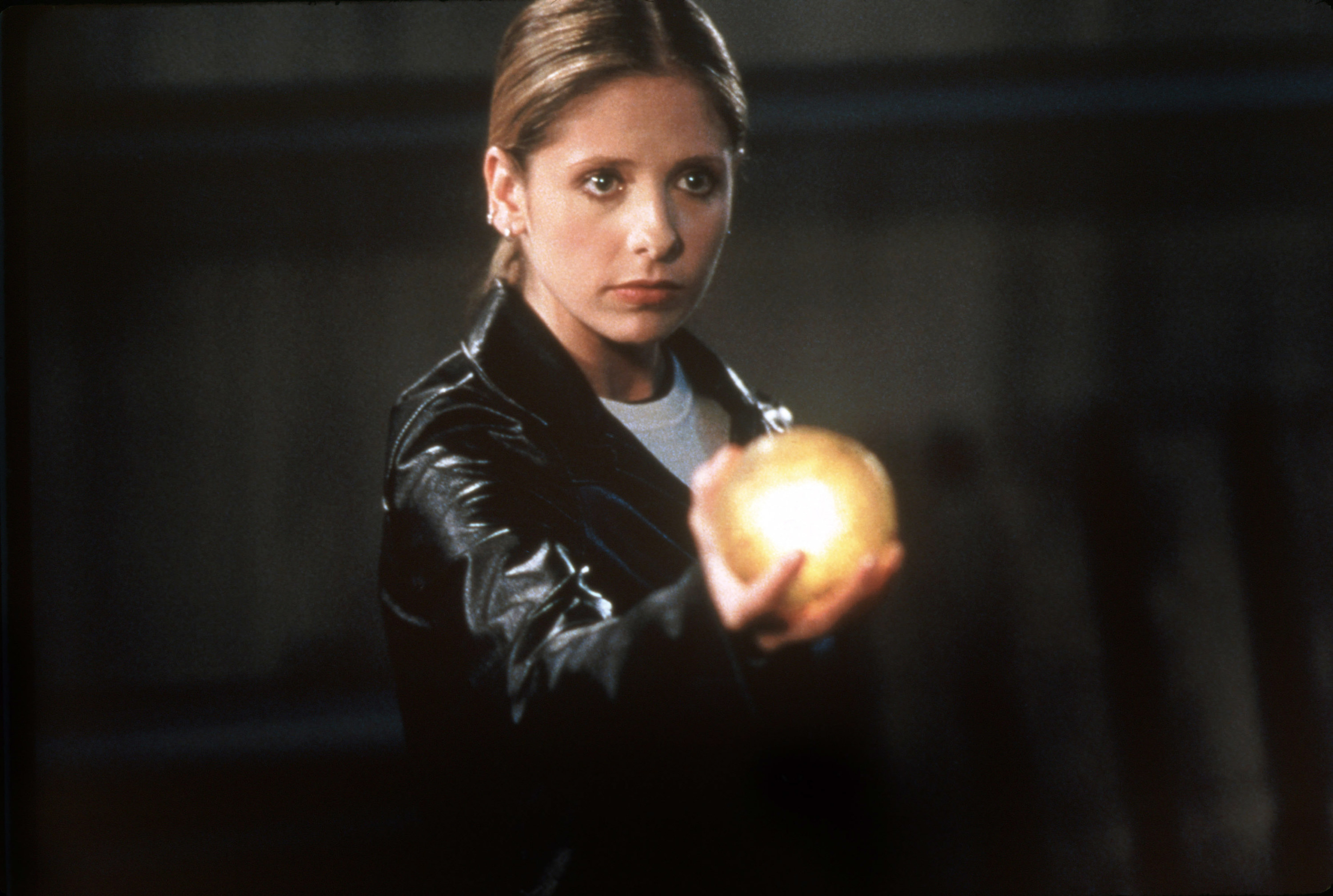 Buffy holding a glowing orb
