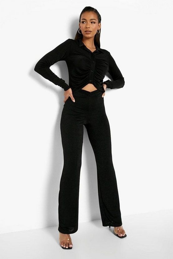 Model wearing the black wide-leg pants