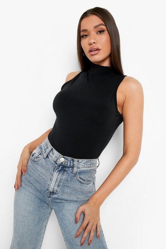 Model wearing the black tank top with jeans