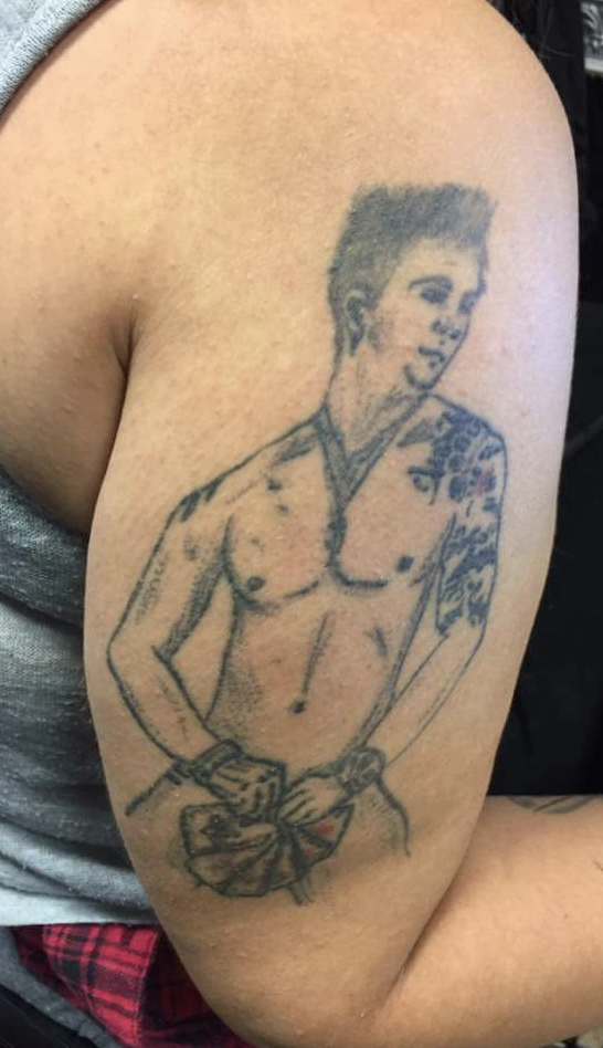 Bad tattoo of Channing Tatum in &quot;Magic Mike,&quot; naked while holding cards over his crotch