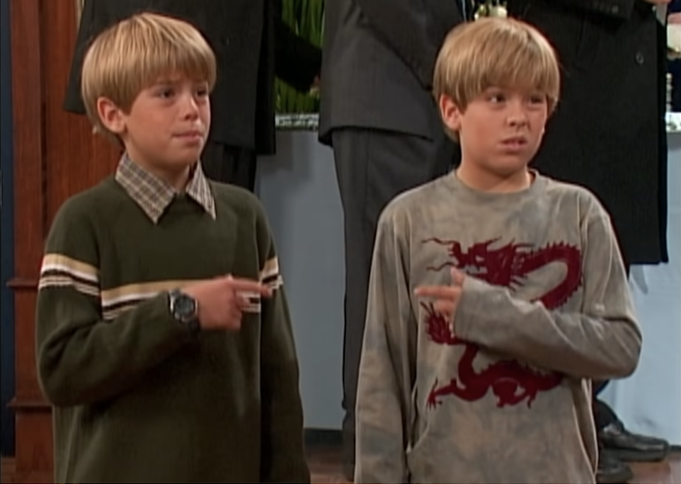 Zack and Cody pointing at each other