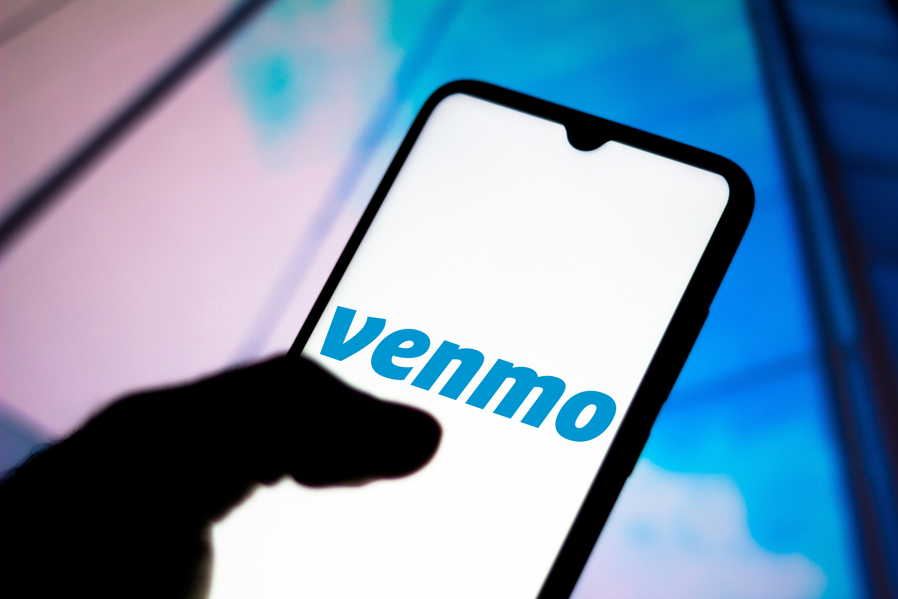 Person using Venmo on their smartphone