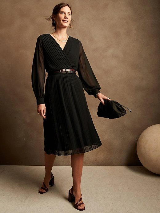 A woman wearing the dress in black